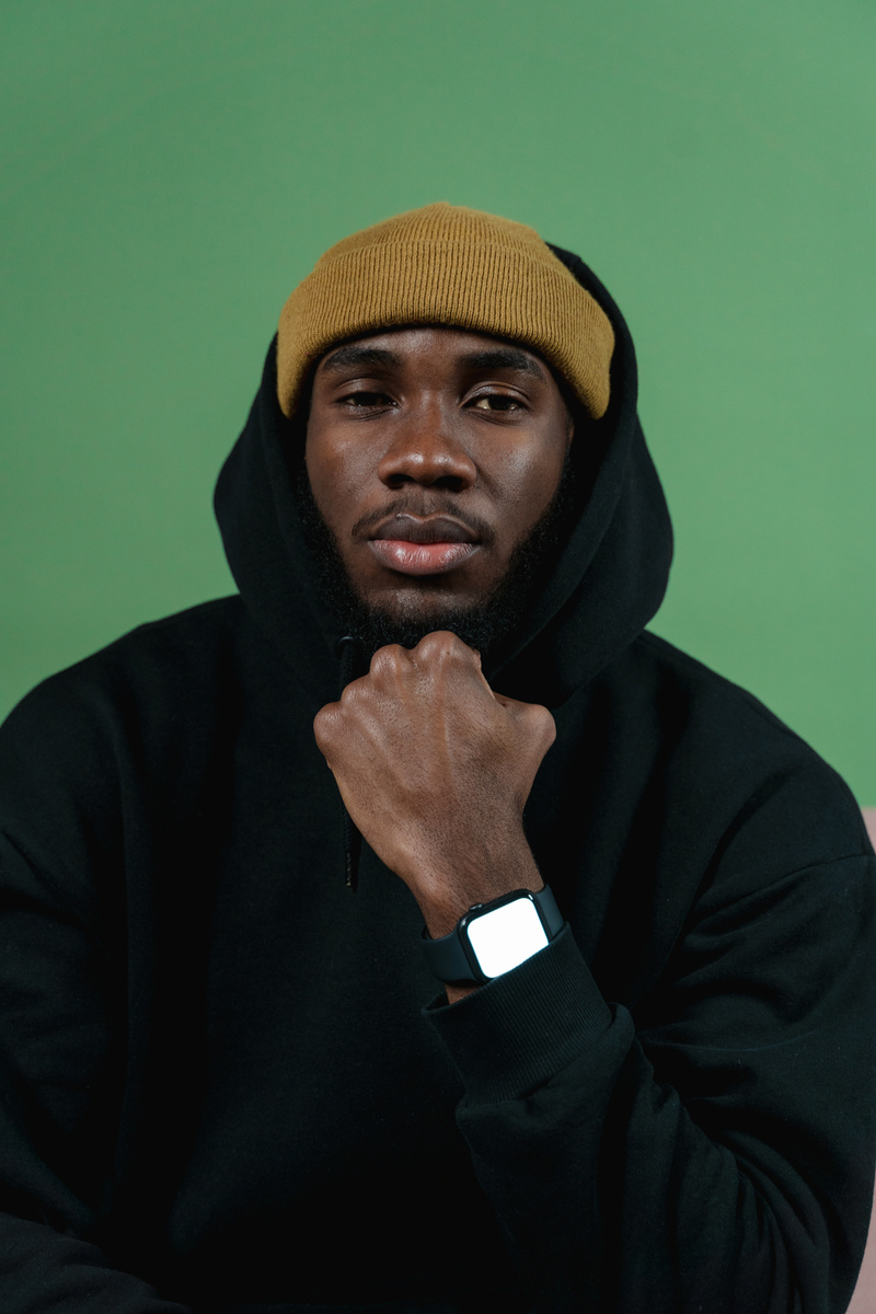 Man in Black Hoodie Showing His Smartwatch
